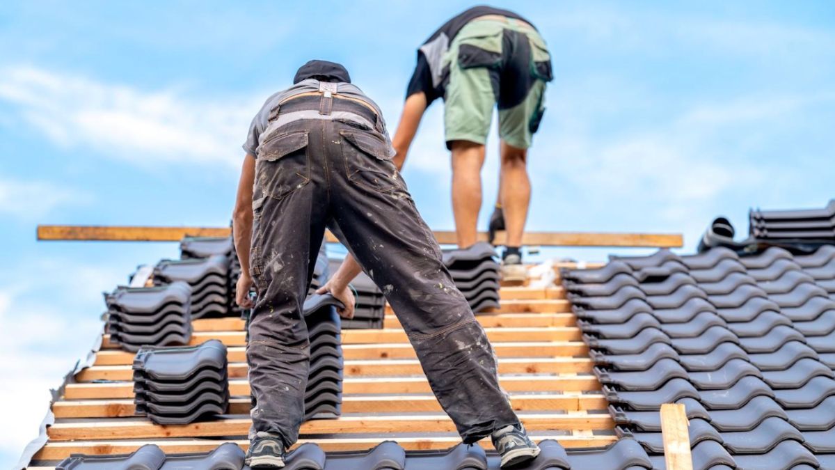 i5Exteriors – Roof Replacement (2) Two Men Finishing Up Roof